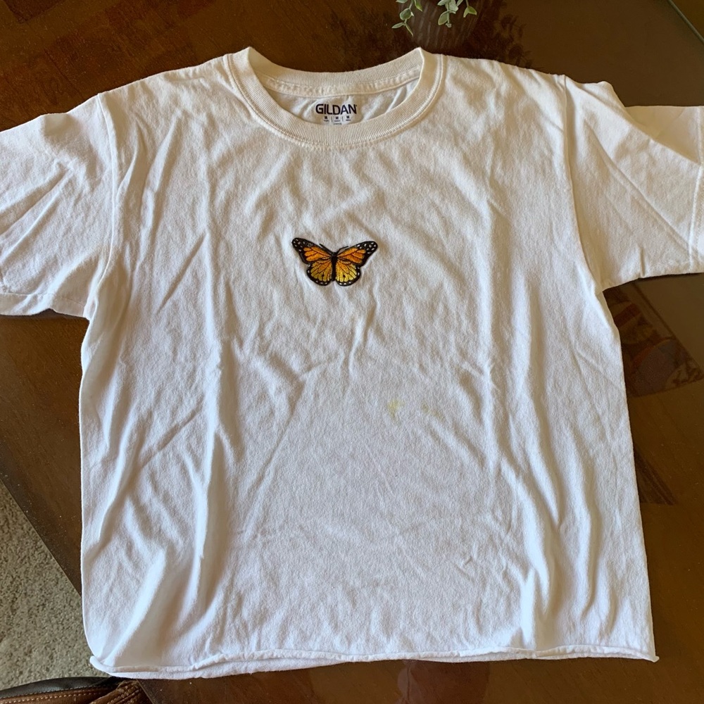 white tee with patched on butterfly